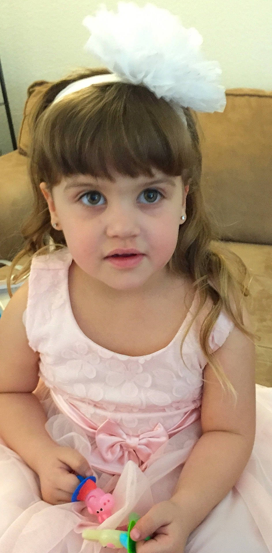 Mackenzie is registered to the contest to win money with this photo: brown_hair, cheek, child, child_model, ear, girl, hair, hair_accessory, hairstyle, happiness, headband, human_hair_color, infant, iris, person, product, skin, smile, textile, toddler