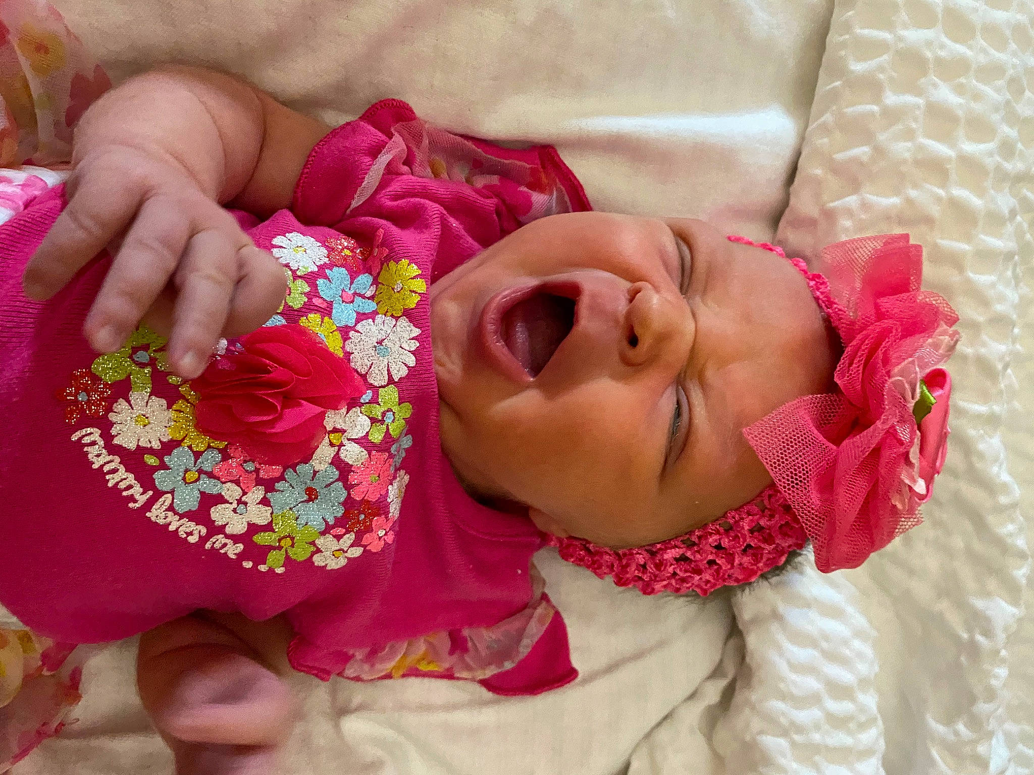Karley is registered to the contest to win money with this photo: baby_toddler_clothing, cheek, child, comfort, eyelash, finger, hand, happy, headgear, headwear, lip, magenta, mouth, nail, neck, person, pink, skin, sleeve, smile