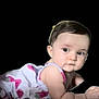 November is registered to the contest to win money with this photo: baby, infant, child, portrait, black_background, strawberry_dress, sleeveless, lying_down, crawling_pose, big_eyes, chubby_cheeks, short_hair, hair_clip, cute, isolated, studio_cutout, skin, gaze, smile_subtle, one_person