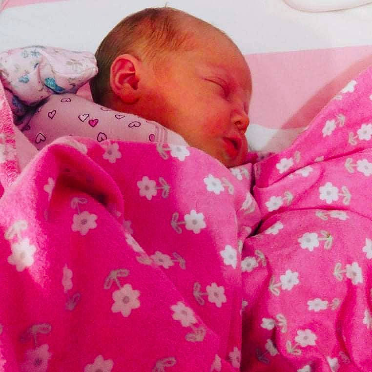 Evalynn is registered to the contest to win money with this photo: baby, baby_products, baby_sleeping, baby_toddler_clothing, bedding, bedtime, cheek, child, comfort, face, happy, linens, magenta, nap, pattern, person, pink, skin, sleeve, textile