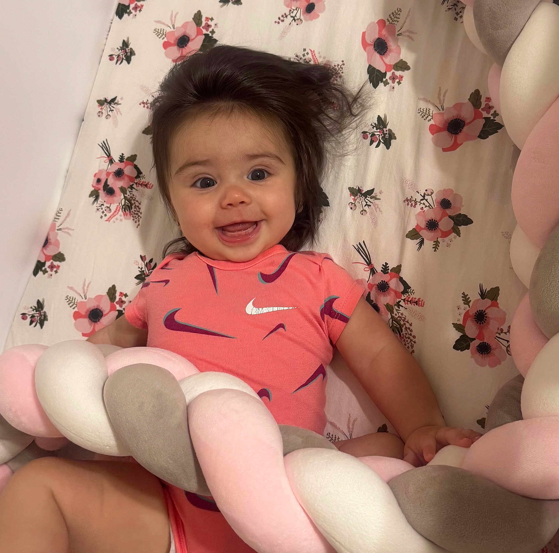 Duleivis joined the competition — help win amazing prizes! baby, smiling, infant, onesie, nike, pink, hair, cushion, braided, floral, blanket, happy, child, cute, playful, indoor, person, soft, pattern, lying