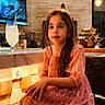 child, girl, dress, pink_dress, sitting, chair, indoor, modern_interior, lighting, glass, lemonade, drink, television, underwater_scene, hair, long_hair, face, expression, warm_light, bar_counter