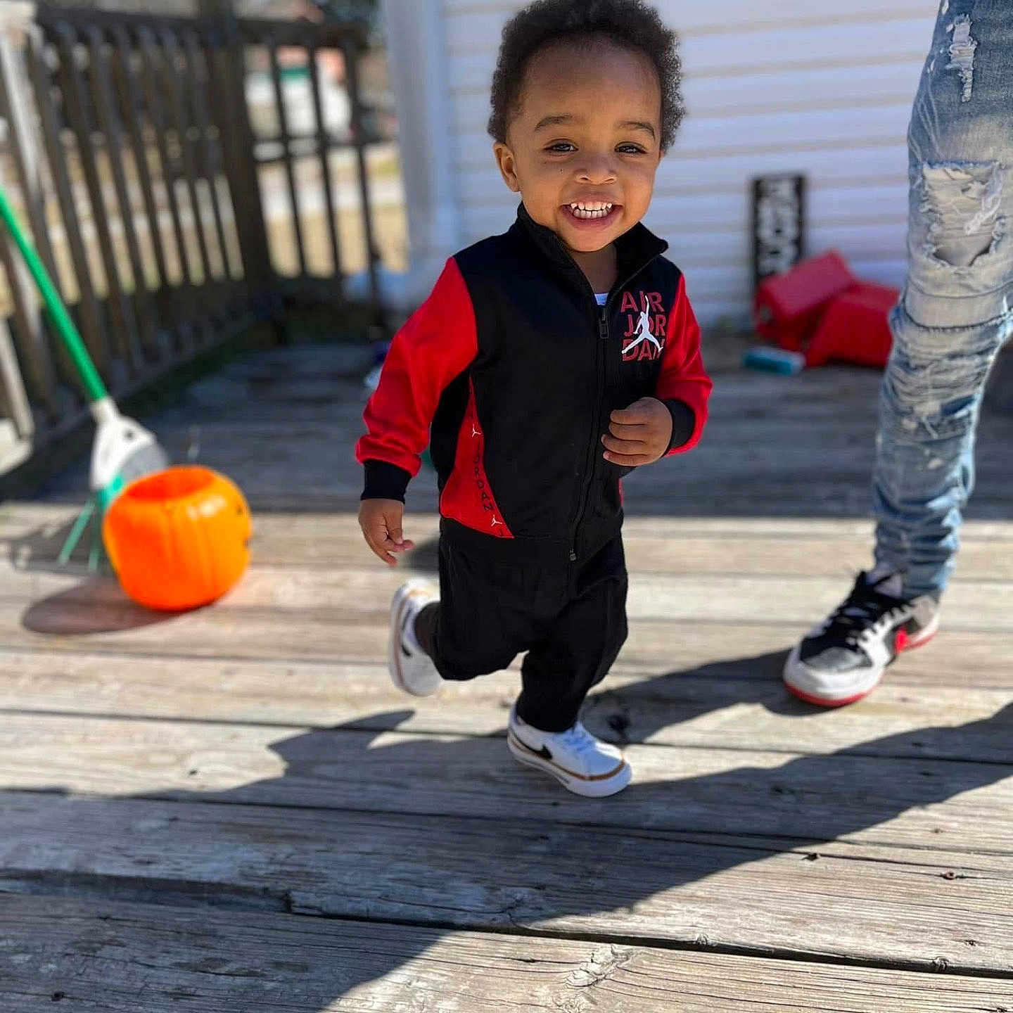 Atlas is registered to the contest to win money with this photo: architecture, boy, building, child, clothing, face, footwear, head, house, housing, male, pants, person, photography, plant, porch, portrait, pottedplant, shoe, wood