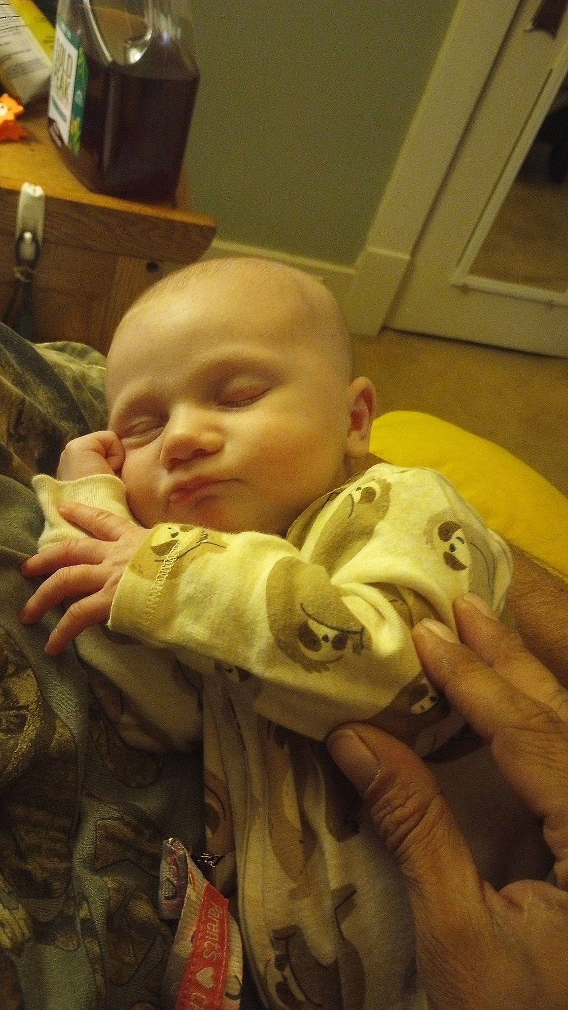 Adeline is registered to the contest to win money with this photo: baby, baby_toddler_clothing, cheek, child, comfort, ear, finger, fun, gesture, happy, iris, mouth, nail, nose, person, room, sitting, skin, sleeve, thumb