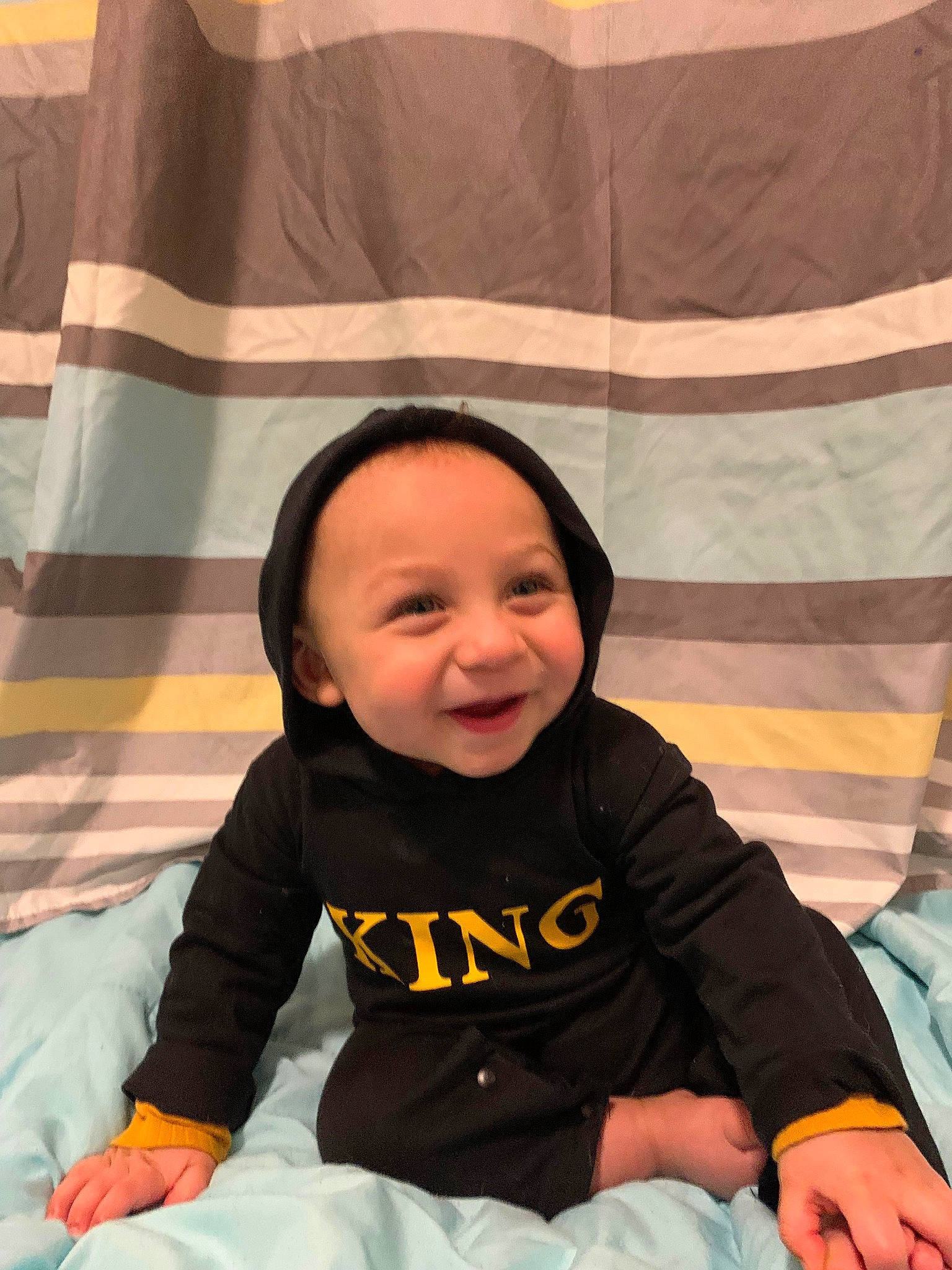 Knowledge is registered to the contest to win money with this photo: baby, baby_toddler_clothing, black, cheek, child, comfort, finger, hairstyle, happy, head, headwear, joy, people, person, photograph, skin, sleeve, smile, snapshot, textile