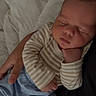 Darvy Domingos Veiga joined the competition — help win amazing prizes! adult_hand, baby, bed, blanket, close_up, cuddling, face, hands, indoors, infant, newborn, nursery, pajamas, peaceful, portrait, relaxed, resting, sleeping, soft_lighting, striped_clothing