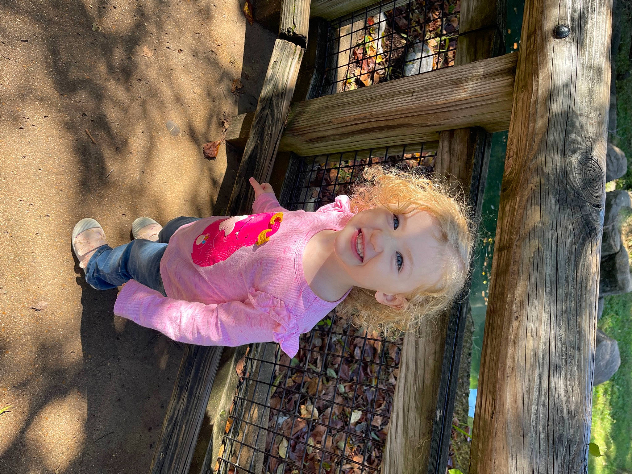 Mckynleigh is registered to the contest to win money with this photo: baby, baby_toddler_clothing, child, fun, grass, happy, joy, leaf, leisure, magenta, people_in_nature, person, sitting, tints_and_shades, toddler, tree, trunk, vacation, wood