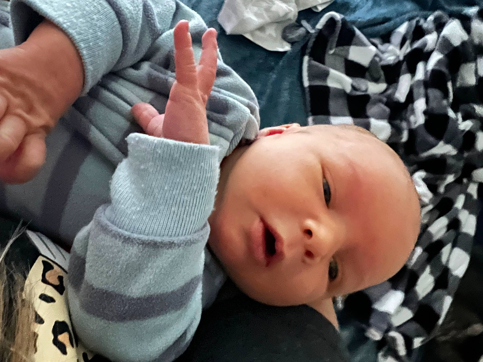 Kolby is registered to the contest to win money with this photo: baby, baby_products, baby_toddler_clothing, cheek, child, comfort, cool, fashion_accessory, finger, gesture, hand, nail, nose, pattern, person, sitting, skin, sleeve, thumb, toddler