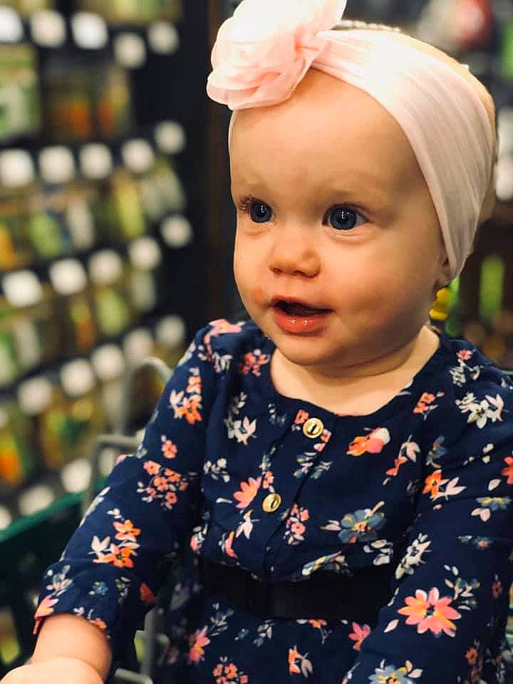 Emma is registered to the contest to win money with this photo: baby, cheek, child, child_model, ear, face, fashion_accessory, hair_accessory, head, headband, headgear, lip, person, skin, smile, toddler