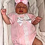 Livvy is registered to the contest to win money with this photo: baby, sleeping, pink_outfit, headband, bow, blanket, bassinet, infant, cute, cozy, newborn, clothing, soft, white, knitted, peaceful, resting, child, portrait, toddler