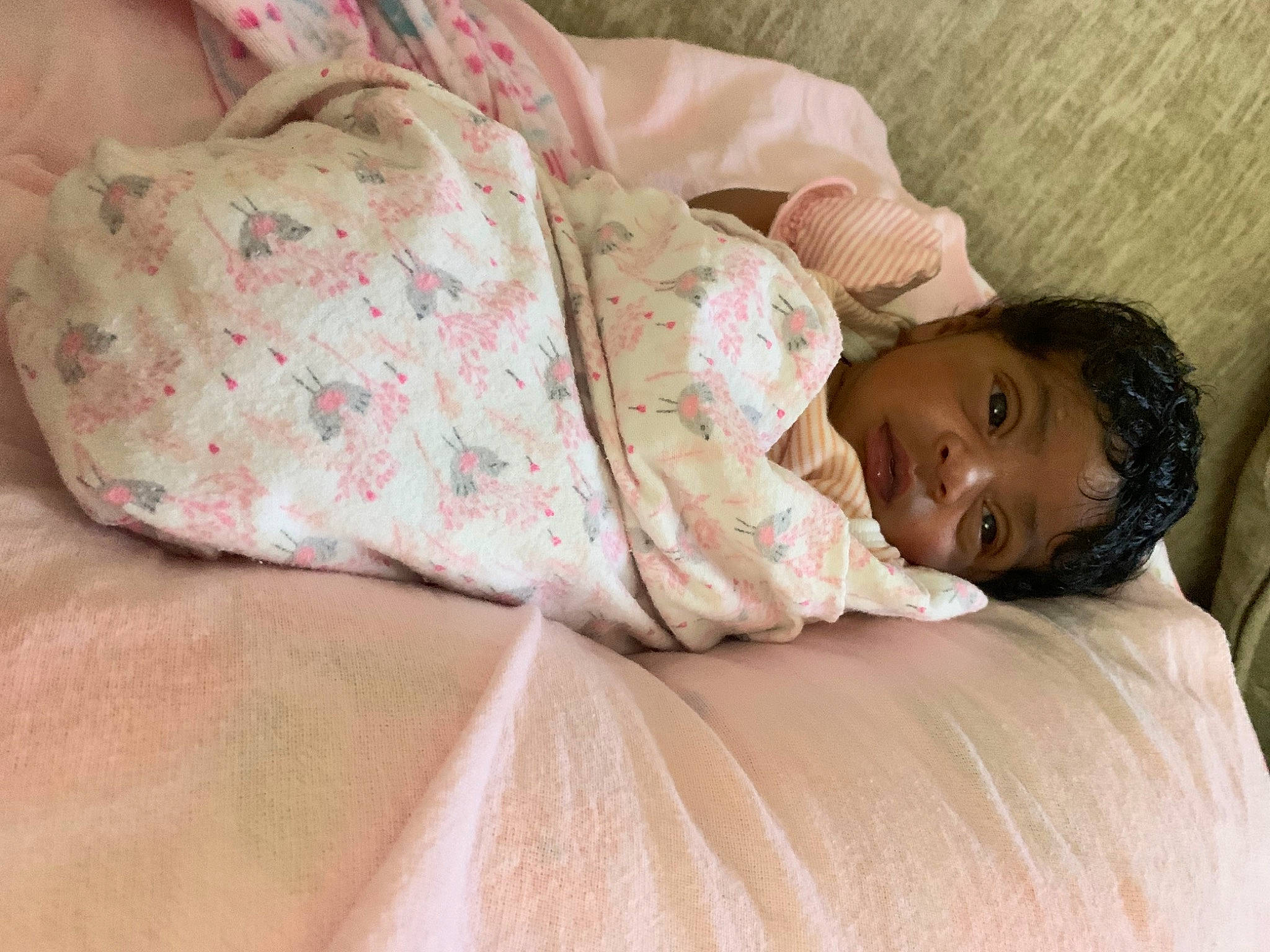 Hazel is registered to the contest to win money with this photo: abdomen, arm, baby, baby_toddler_clothing, bedding, bedtime, cheek, child, comfort, couch, human_body, human_leg, leg, linens, nose, pattern, person, room, skin, sleeve