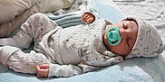 Ronen is registered to the contest to win money with this photo: baby, sleeping, pacifier, pajamas, hat, blanket, bed, infant, child, cozy, soft, cute, resting, newborn, indoors, comfort, peaceful, person, sleep, nursery