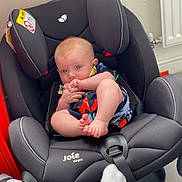 Hudson joined the competition — help win amazing prizes! baby, car, car_interior, carseat, chair, clothing, cushion, face, furniture, head, homedecor, hosiery, person, photography, portrait, sitting, sleeping, sock, transportation, vehicle