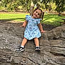 Kehlani joined the competition — help win amazing prizes! child, toddler, smiling, blue_dress, sneakers, tree_trunk, park, outdoor, nature, grass, sunlight, playful, cute, happy, person, pigtails, daytime, wood, casual, recreation