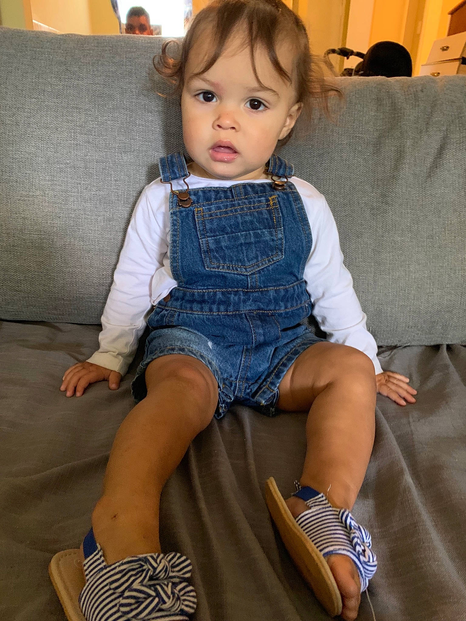 Deliah is registered to the contest to win money with this photo: chair, child, child_model, denim, footwear, furniture, human_leg, jeans, knee, leg, person, shoe, sitting, thigh, toddler