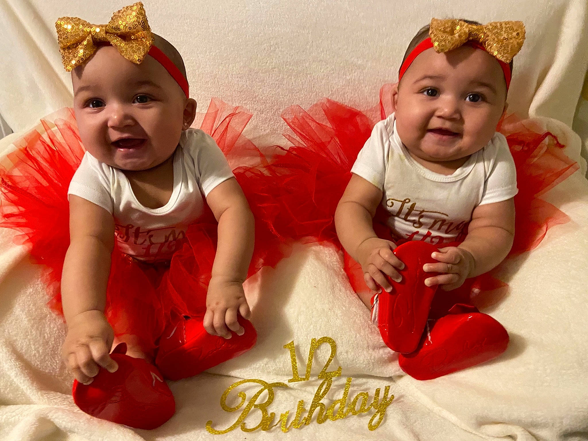 Hawkins Twins is registered to the contest to win money with this photo: baby, baby_toddler_clothing, beauty, cap, child, costume_hat, face, facial_expression, fun, happy, headgear, headwear, human, joy, person, pink, product, red, skin, sleeve