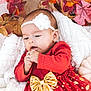 Ariella joined the competition — help win amazing prizes! baby, infant, child, red_dress, gold_bow, white_headband, flower, blanket, autumn_leaves, pumpkin, fall, seasonal, cute, cozy, portrait, outdoor, nature, holiday, festive, toddler