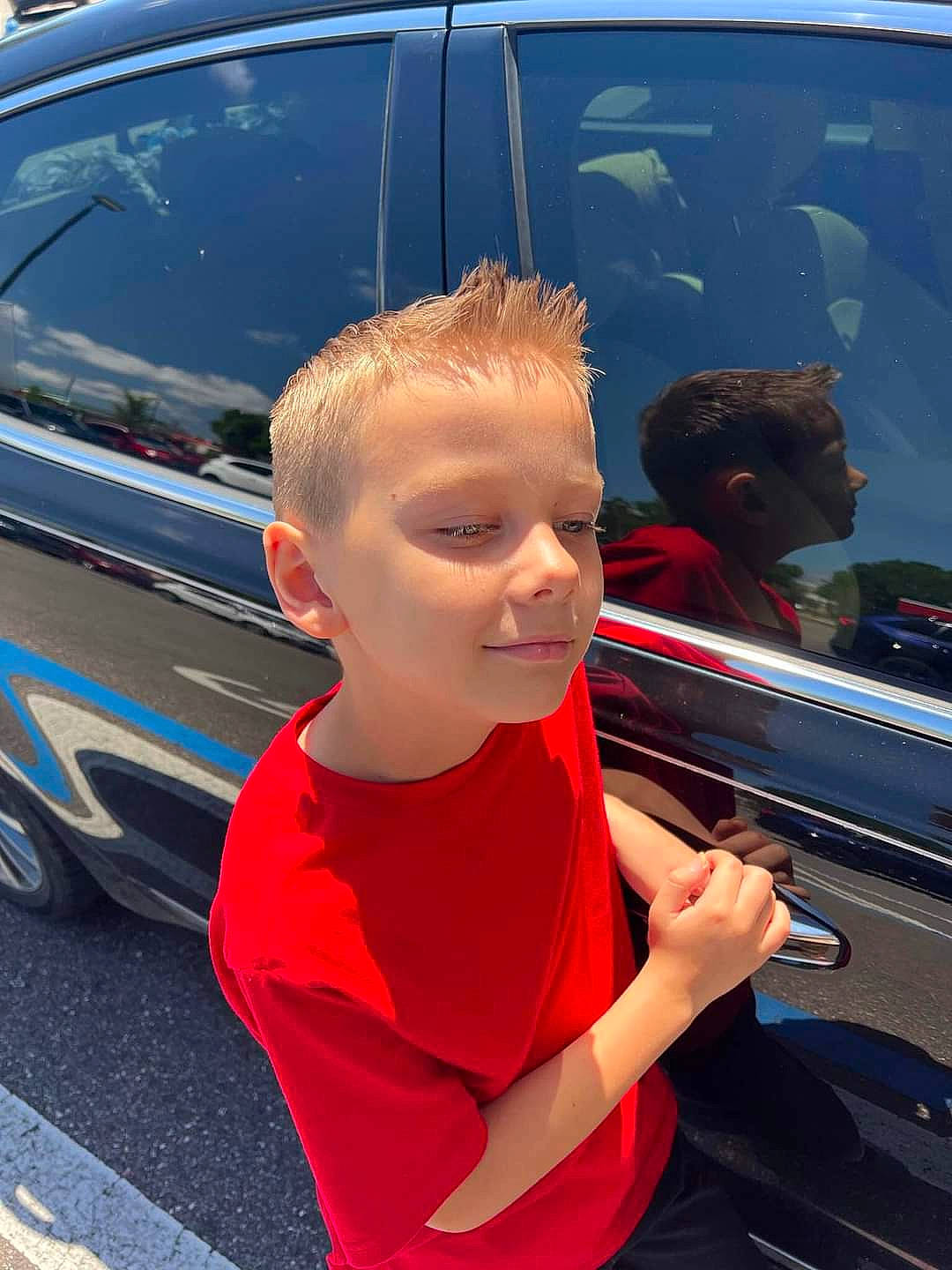 Brandon joined the competition — help win amazing prizes! auto_part, automotive_design, automotive_exterior, automotive_lighting, automotive_tire, automotive_window_part, bumper, car, electric_blue, fender, glass, grille, hood, motor_vehicle, person, personal_luxury_car, toddler, trunk, under_exposed, vehicle