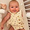 Emersyn joined the competition — help win amazing prizes! baby, smiling, infant, dress, wooden_buttons, ladybug_pattern, crib, stuffed_toy, soft_surface, cute, happy, child, young, portrait, indoors, person, closeup, skin, furniture, sleeping_area
