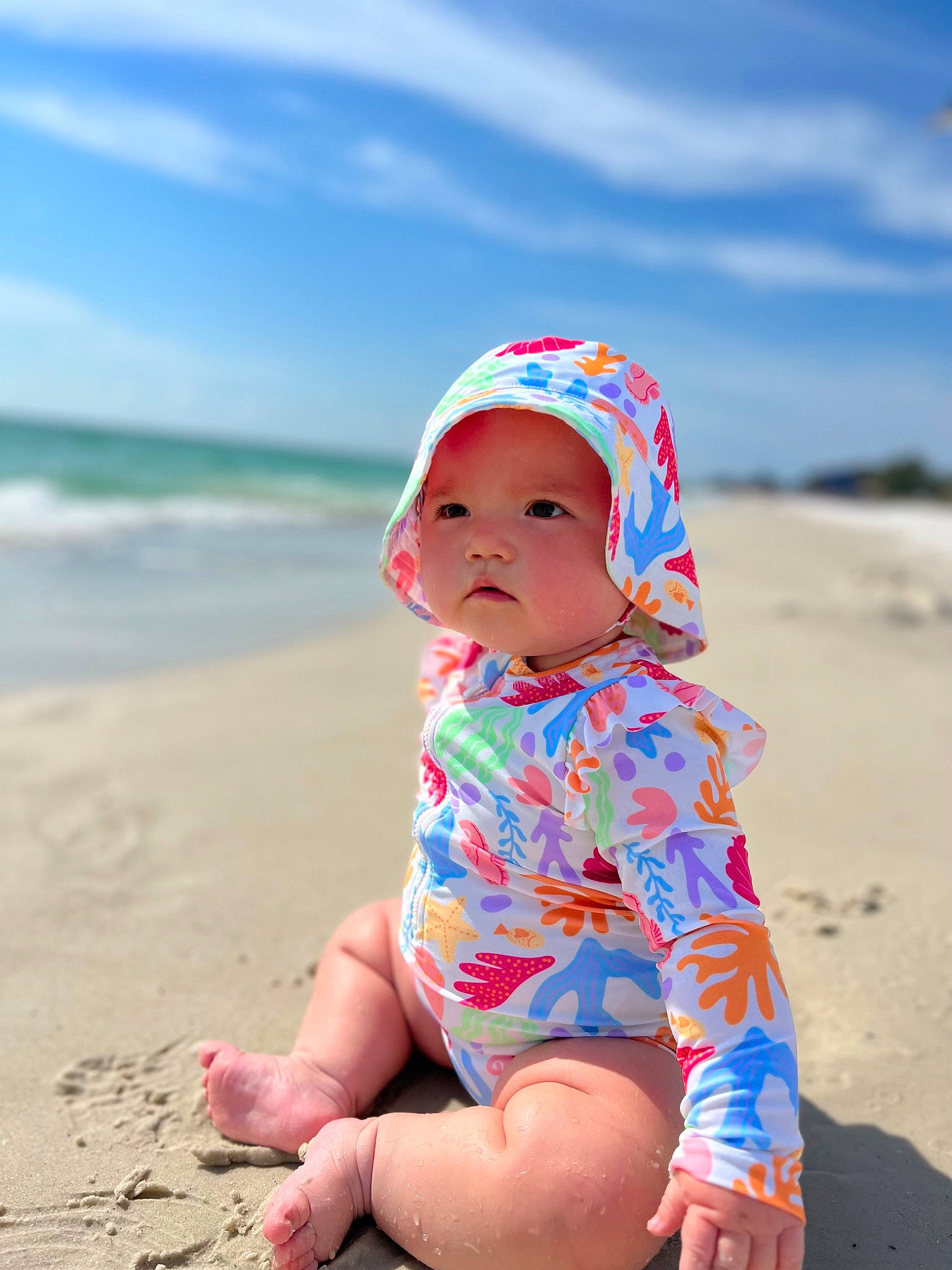 Sofia is registered to the contest to win money with this photo: baby, baby_toddler_clothing, beach, cloud, fun, happy, hat, headgear, headwear, holiday, horizon, landscape, leisure, people_in_nature, people_on_beach, person, sand, sky, summer, toddler