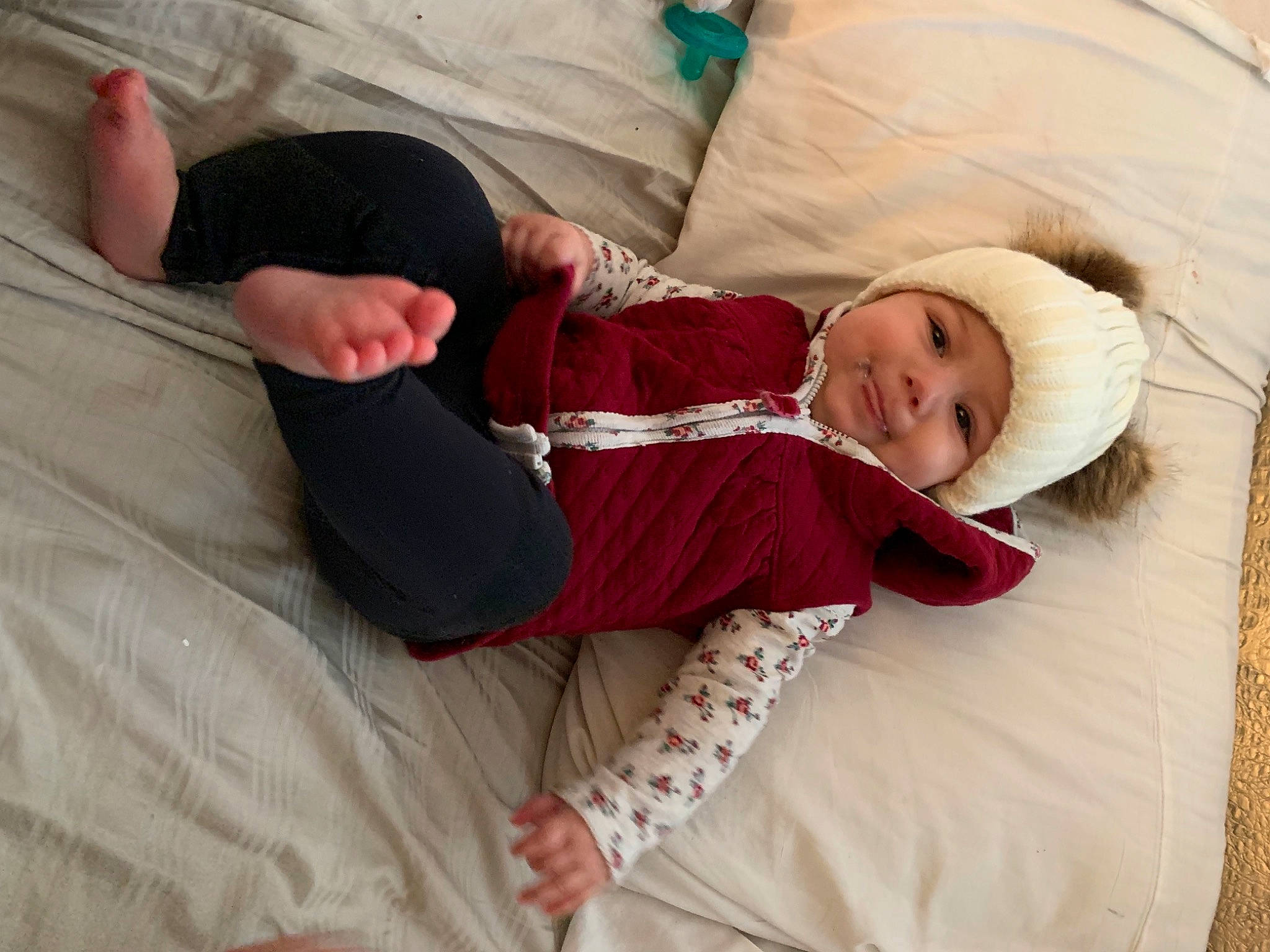 Gracie is registered to the contest to win money with this photo: baby, baby_toddler_clothing, comfort, foot, headwear, human, linens, person, sock