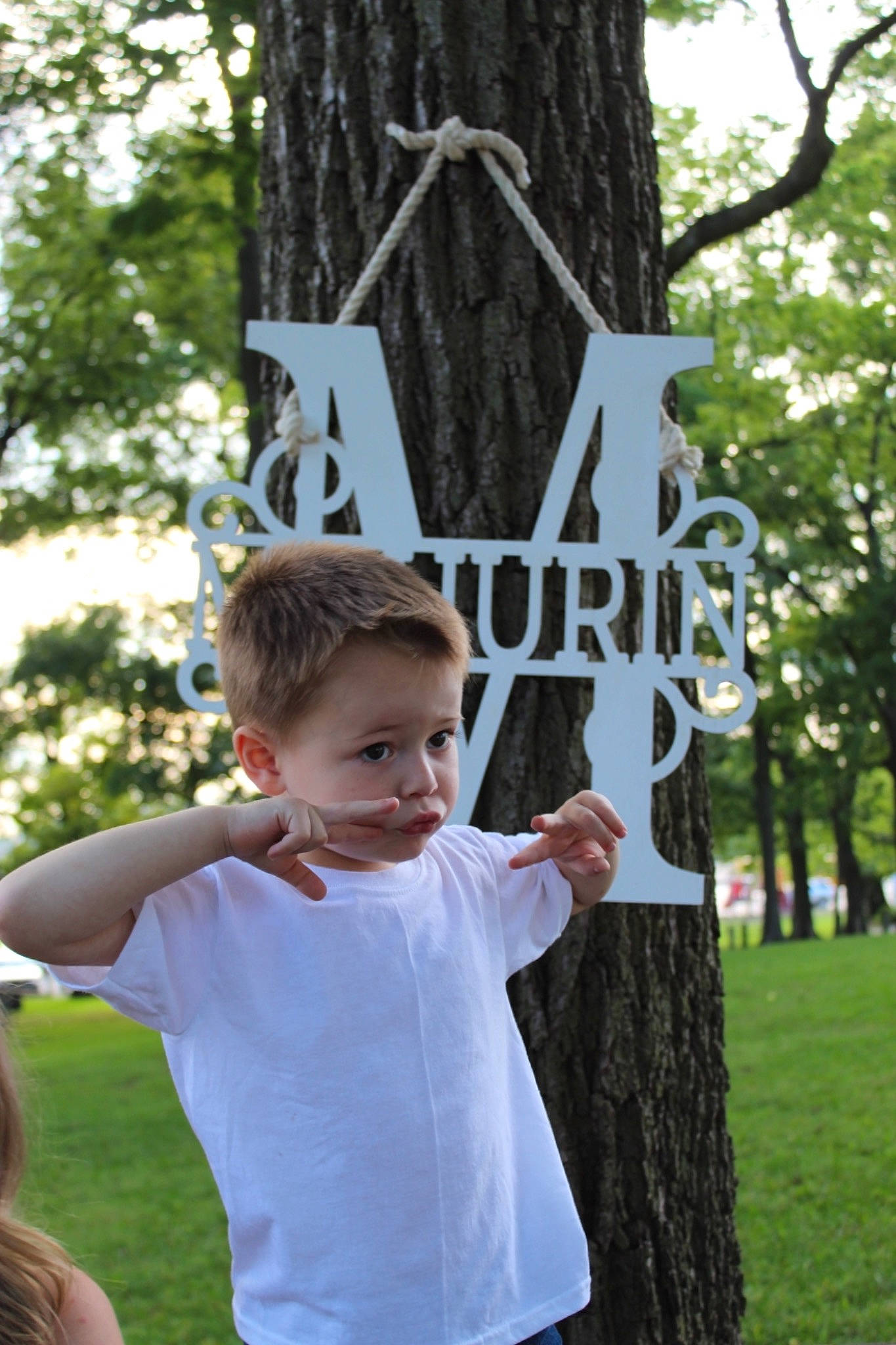 Bentley is registered to the contest to win money with this photo: gesture, person, tree, trunk