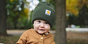 Daniel joined the competition — help win amazing prizes! child, toddler, beanie, hat, brown_sweater, buttoned_shirt, outdoor, autumn, fall, trees, blurred_background, cute, portrait, young_child, face, smile, nature, seasonal, warm_clothing, daylight