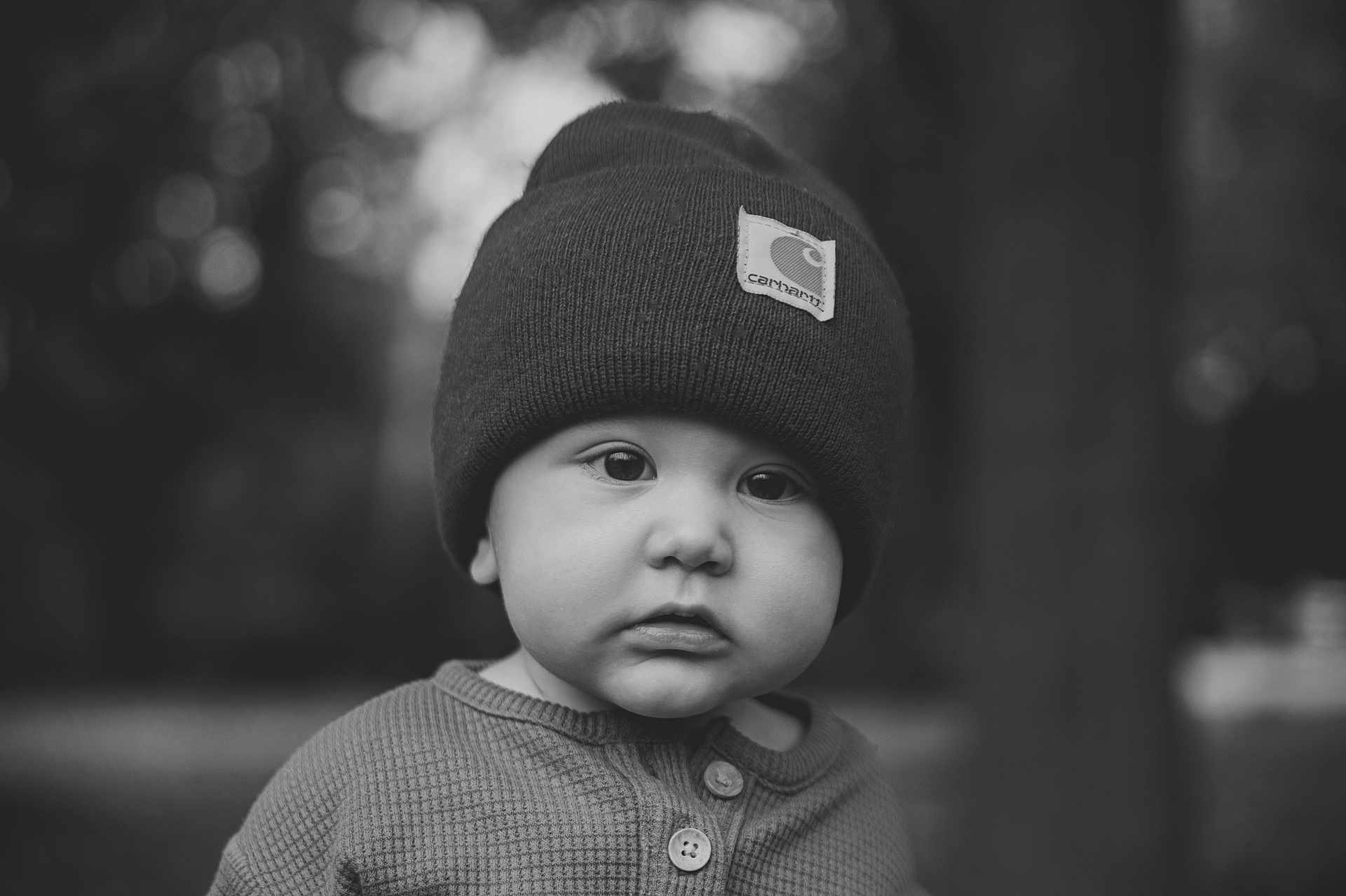 Daniel joined the competition — help win amazing prizes! baby, child, beanie, hat, portrait, black_and_white, outdoor, face, expression, wool, knitwear, cute, young, infant, clothing, closeup, headwear, buttoned_shirt, nature, soft_focus