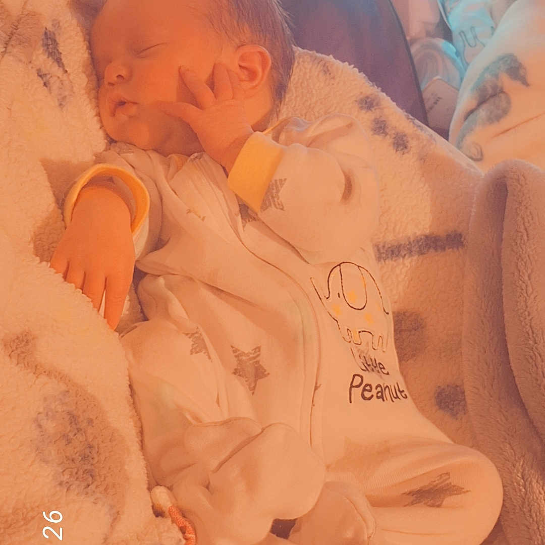 Ashton joined the competition — help win amazing prizes! baby, sleeping, newborn, blanket, onesie, cozy, indoor, child, infant, soft, peaceful, bed, clothing, warm_light, resting, cute, portrait, hands, face, sleep