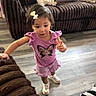 Zelda joined the competition — help win amazing prizes! child, girl, purple_outfit, butterfly, bow_hair, sneakers, living_room, couch, wooden_floor, curious, motion, indoors, plush, home, person, casual_clothing, cute, toddler, exploring, young_child