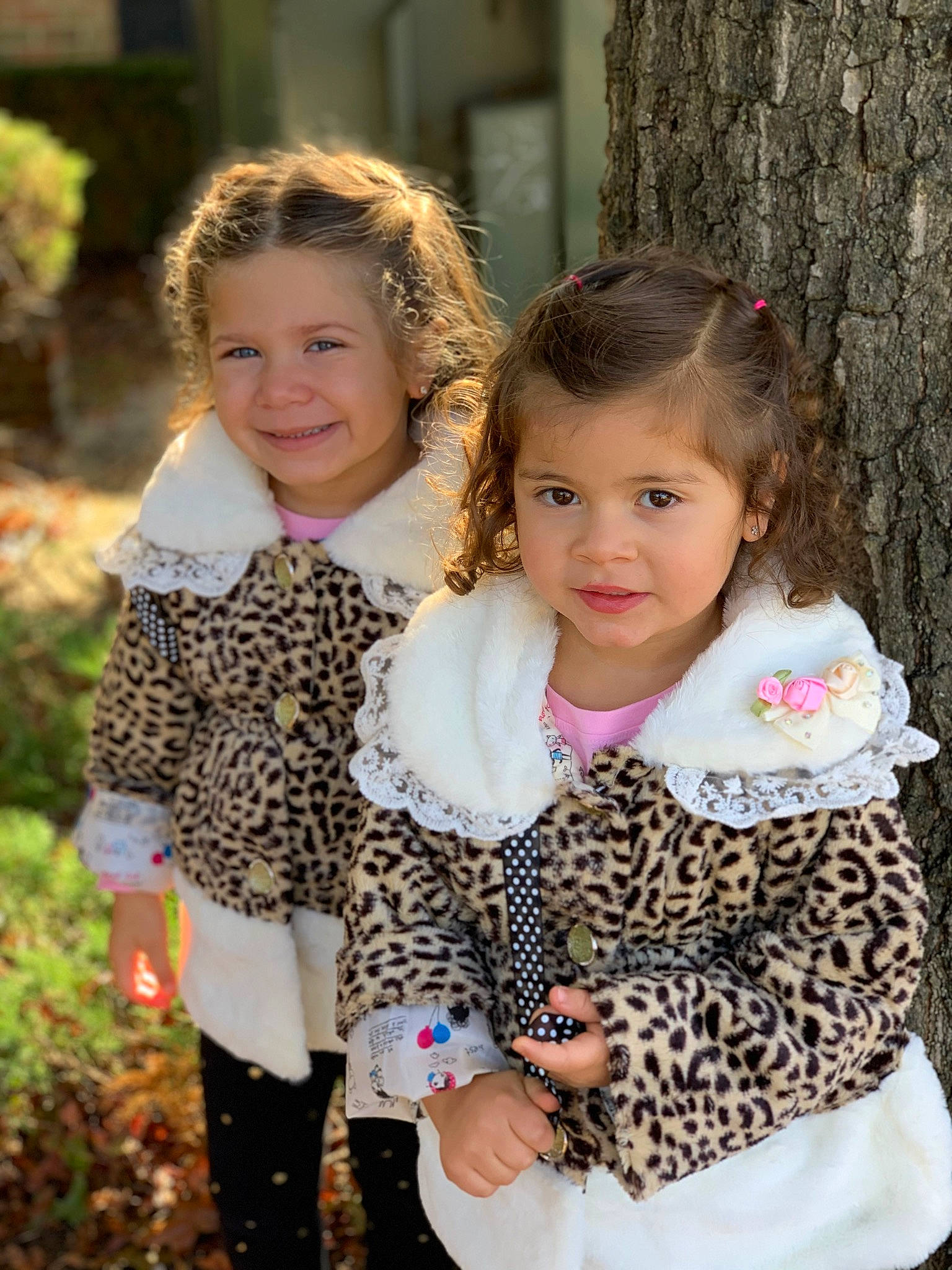 Frankie Marie is registered to the contest to win money with this photo: child, daughter, family, iris, joy, outerwear, pattern, people, person, plant, sibling, smile, toddler, tree