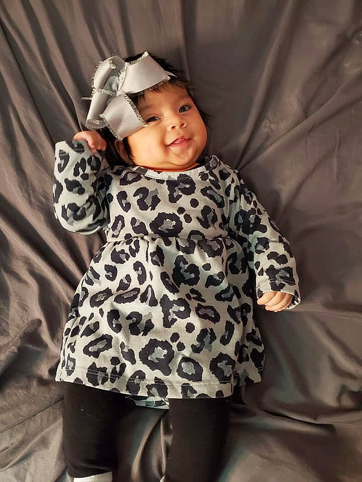 Metzli joined the competition — help win amazing prizes! arm, baby, baby_toddler_clothing, child, comfort, dress, face, finger, gesture, happy, headwear, leg, one_piece_garment, outerwear, person, sleeve, smile, standing, textile, thigh