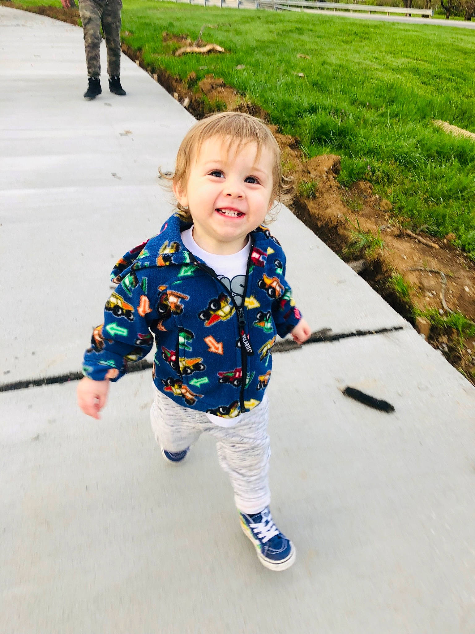 Hayes is registered to the contest to win money with this photo: asphalt, baby, baby_toddler_clothing, child, electric_blue, fun, grass, happy, joy, leisure, pattern, people_in_nature, person, photograph, plant, public_space, recreation, sleeve, smile, toddler