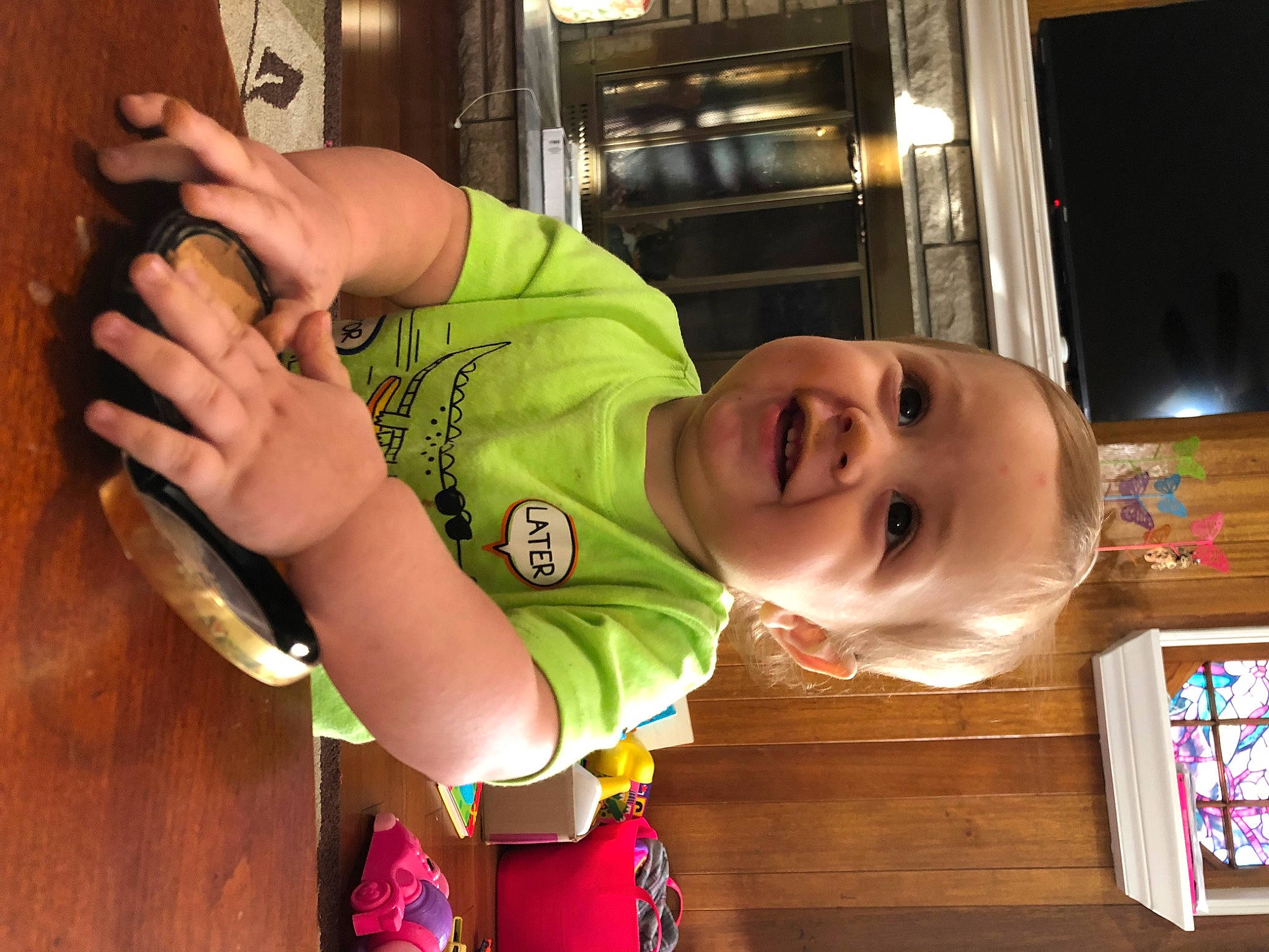 Hayes joined the competition — help win amazing prizes! baby, baby_laughing, baby_toddler_clothing, child, elbow, facial_expression, finger, fun, gesture, happy, leisure, mouth, person, room, sign_language, smile, t_shirt, thumb, toddler, wood