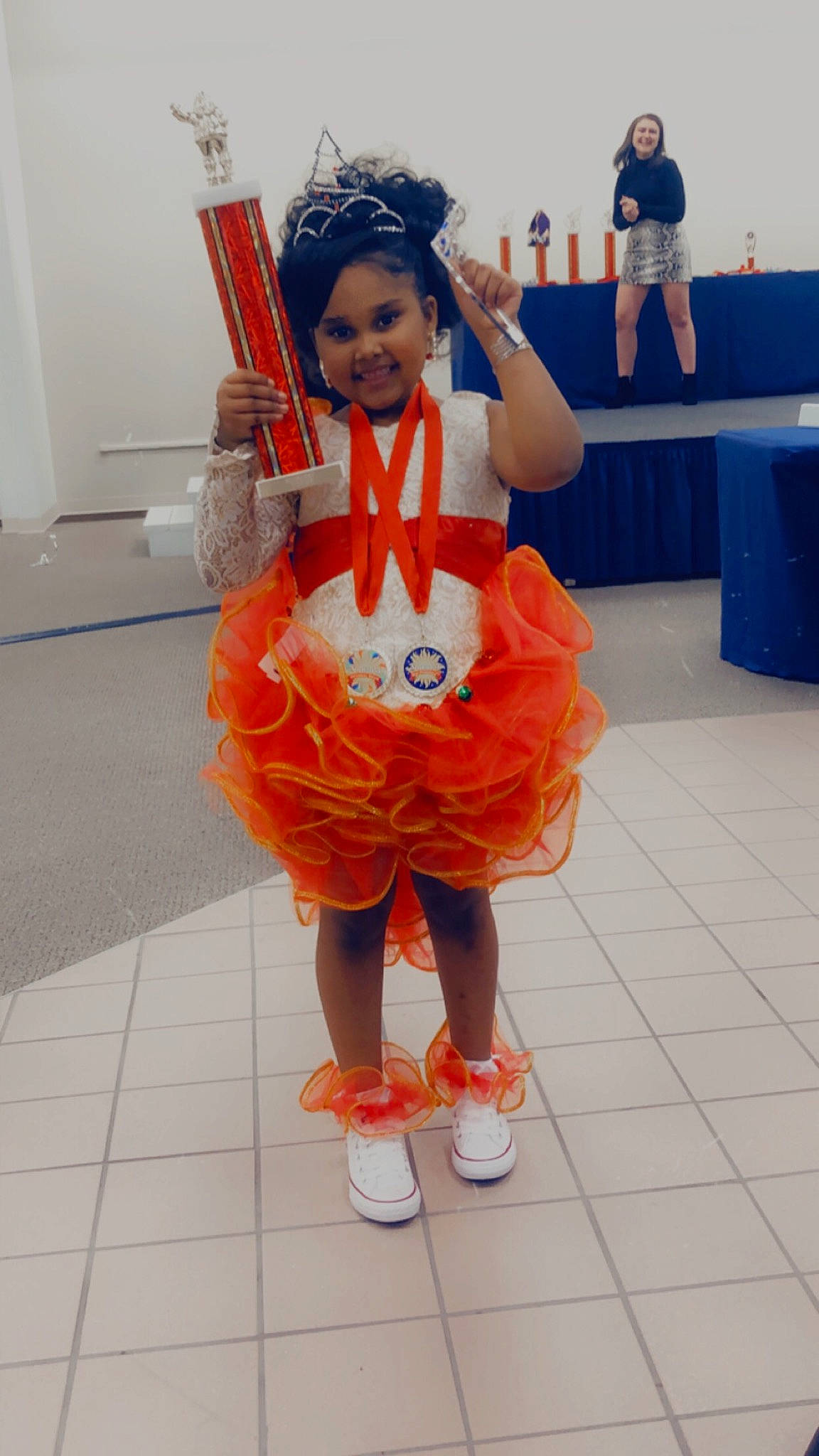 Keaila Jacinth is registered to the contest to win money with this photo: animation, blurred, child, costume_design, dance, entertainment, event, fashion_design, flooring, fun, glove, happy, human_leg, joy, orange, performing_arts, person, shoe, smile, sneakers