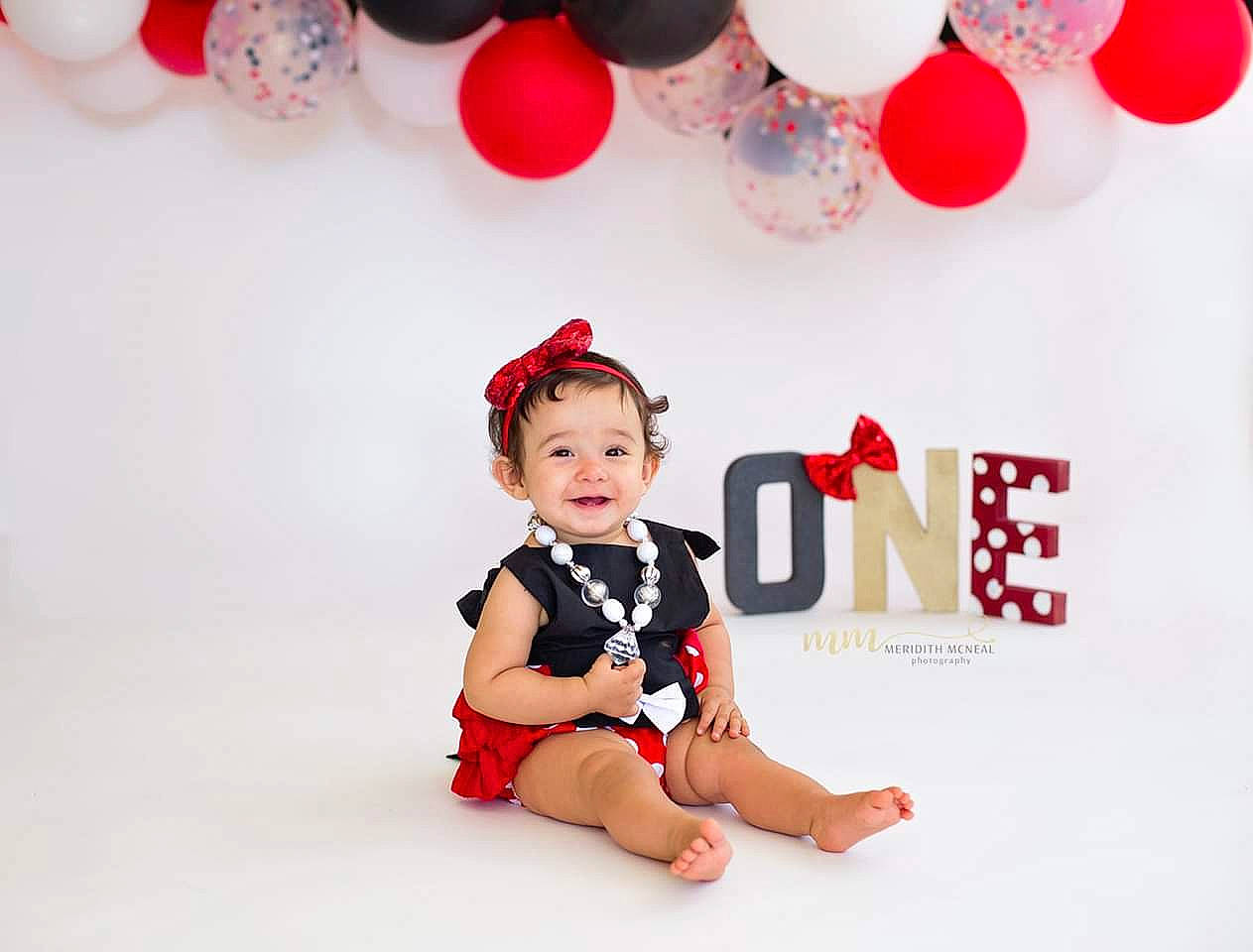 Rosalia is registered to the contest to win money with this photo: baby, baby_toddler_clothing, balloon, child, child_model, design, happy, party, party_supply, pattern, person, red, sleeve, smile, toddler
