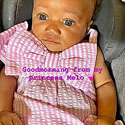 Melody is registered to the contest to win money with this photo: baby, infant, child, portrait, sitting, pink_clothing, dress, chair, car_seat, indoor, face, eyes, wide_eyed, curly_hair, hands, photograph, screen_capture, social_media, text_overlay, smiling_reactions