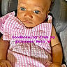 baby, infant, child, portrait, sitting, pink_clothing, dress, chair, car_seat, indoor, face, eyes, wide_eyed, curly_hair, hands, photograph, screen_capture, social_media, text_overlay, smiling_reactions