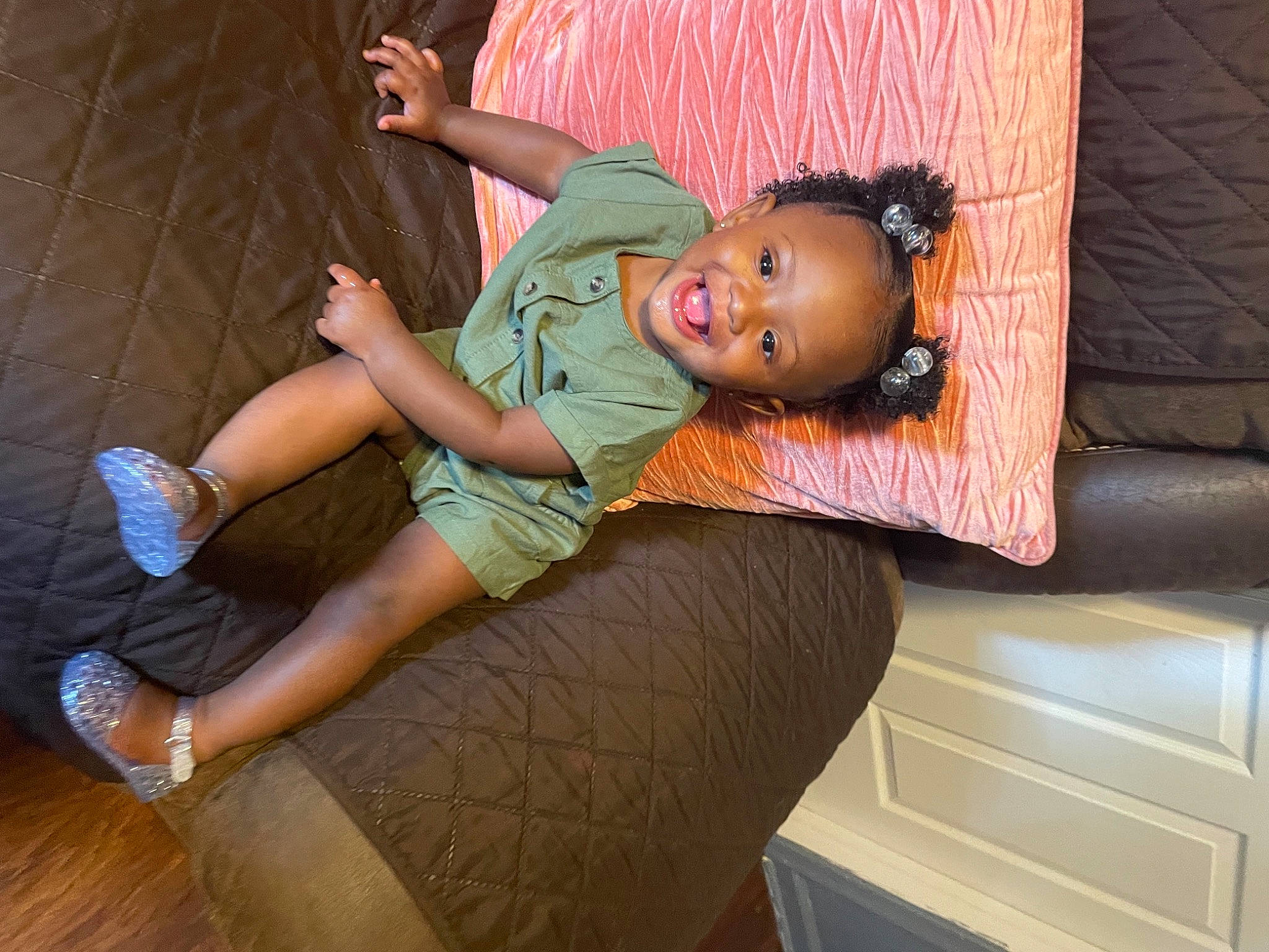 Kaliah is registered to the contest to win money with this photo: child, comfort, doll, fun, hat, human_leg, joint, joy, knee, leg, leisure, long_hair, person, room, sandal, shorts, sitting, thigh, toddler, toy