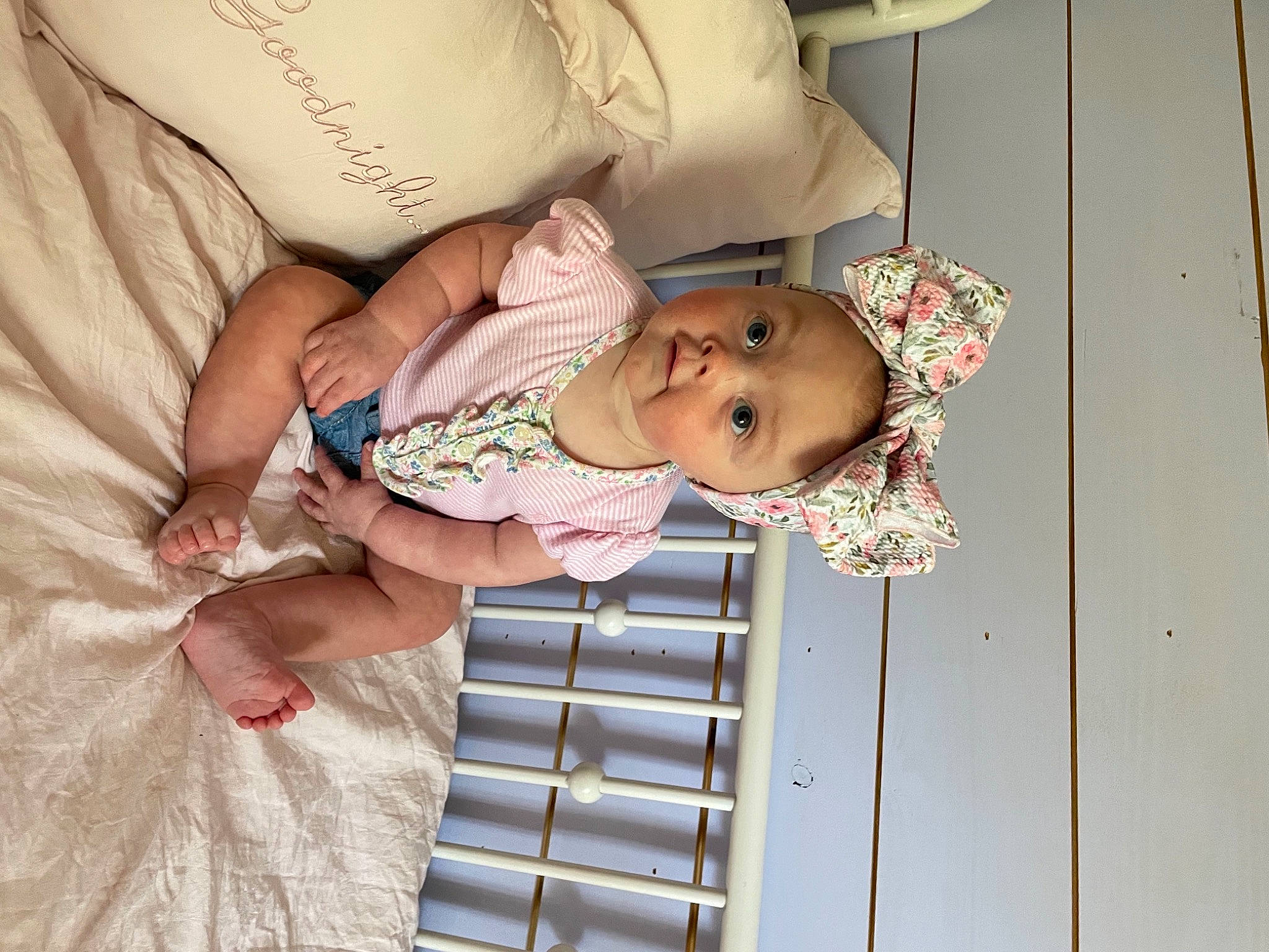 Oaklynn is registered to the contest to win money with this photo: baby, baby_products, baby_safety, baby_toddler_clothing, child, comfort, eye, happy, hat, head, linens, pattern, person, pink, room, skin, smile, surprise, toddler, wood