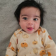 Alexander joined the competition — help win amazing prizes! baby, child, face, tongue, hair, eyes, smile, infant, cute, lying_down, blanket, clothing, pumpkin, fall_theme, playful, portrait, indoors, cozy, happy, young