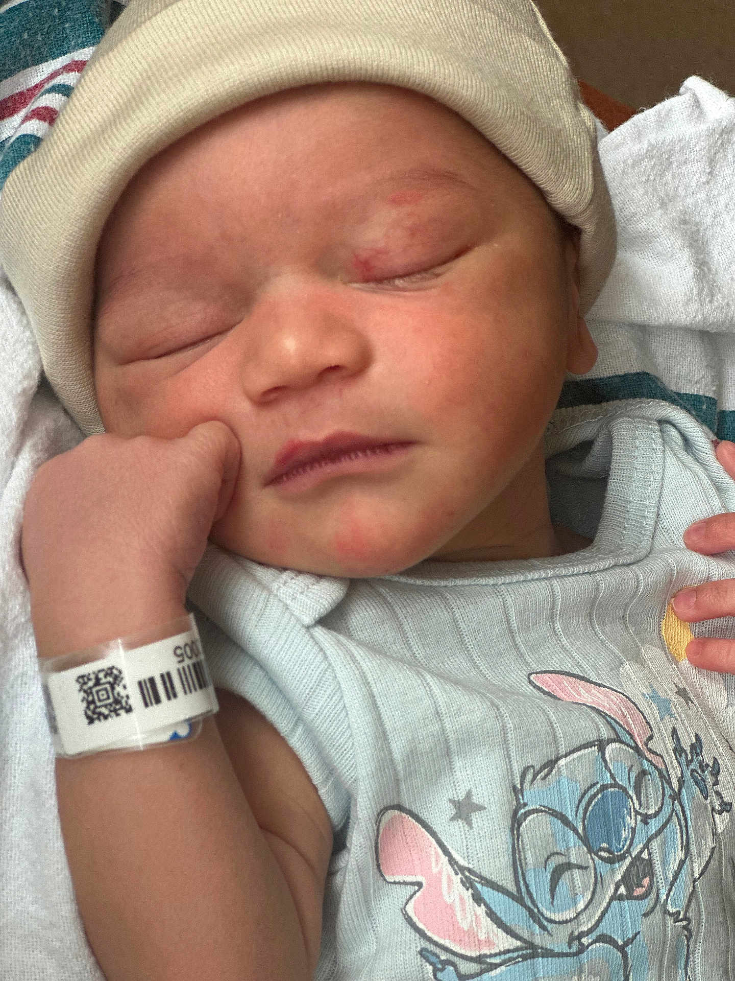 Prince joined the competition — help win amazing prizes! newborn, baby, sleeping, hat, onesie, cartoon_character, hospital_wristband, infant, closeup, face, hand, skin, cute, peaceful, clothing, bed, blanket, resting, indoors, portrait