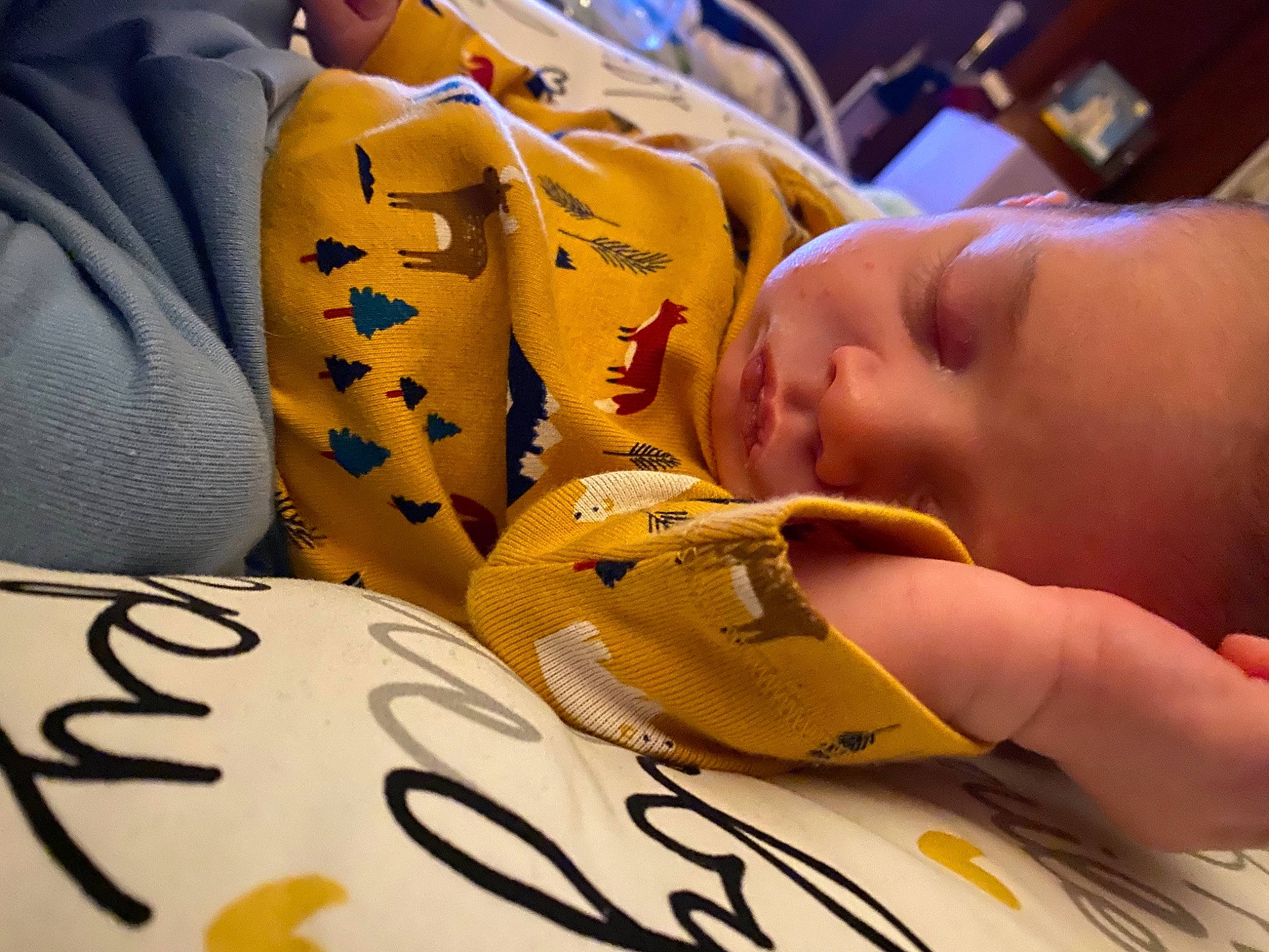 Isaac is registered to the contest to win money with this photo: baby, carmine, child, close_up, comfort, comfort_food, eyelash, finger, font, fun, happy, hat, human, nail, person, personal_protective_equipment, room, snapshot, thumb, toddler