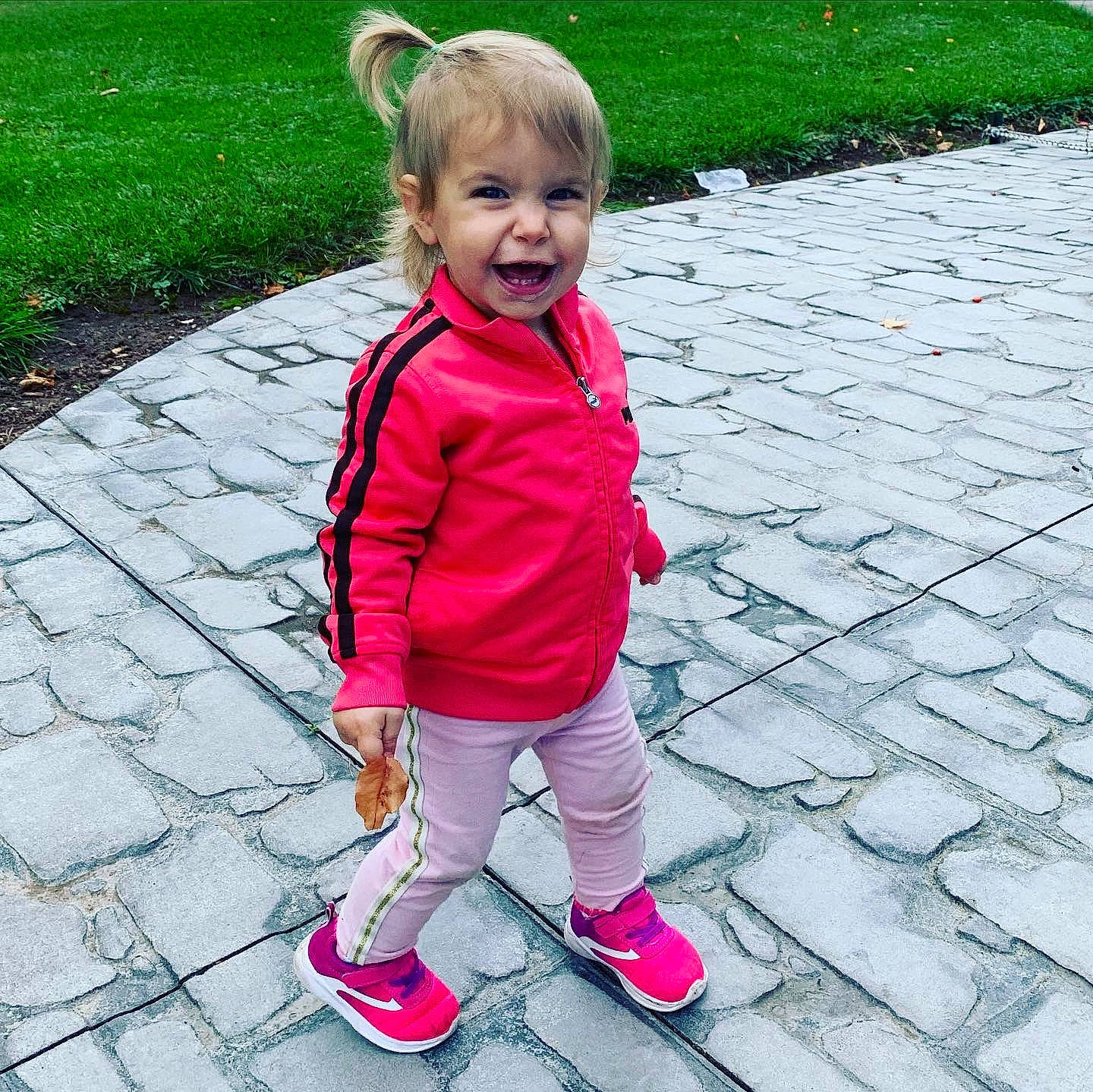 Kaydence joined the competition — help win amazing prizes! baby, child, flower, footwear, grass, happy, outerwear, person, pink, plant, play, recreation, shoe, smile, toddler, vacation, walking, water