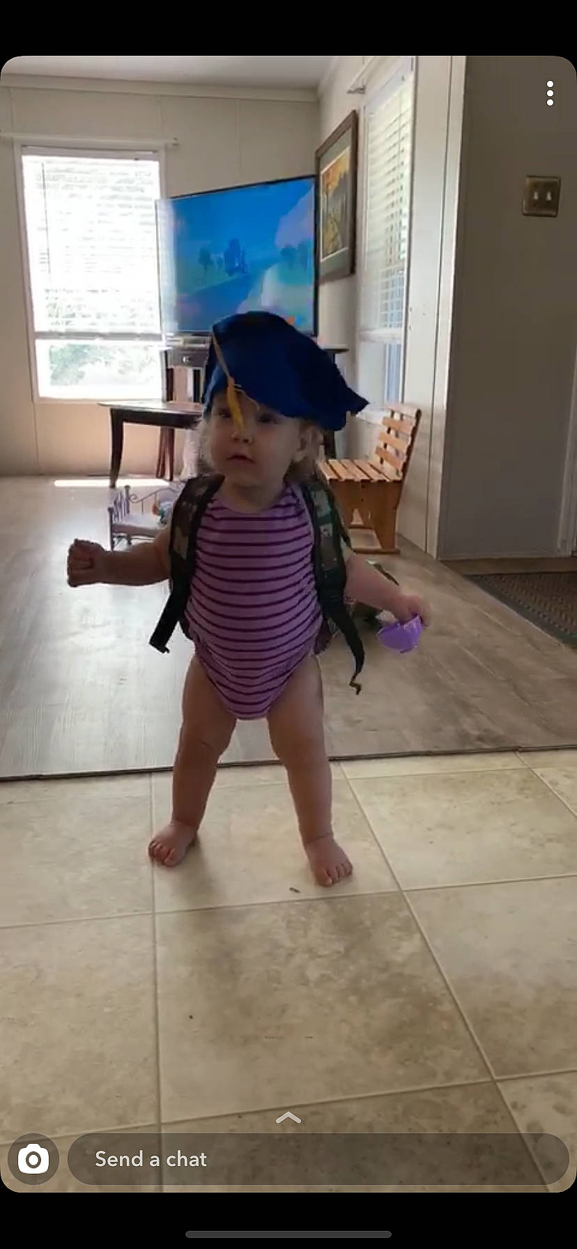 Kaydence is registered to the contest to win money with this photo: child, costume, fashion_accessory, floor, flooring, fun, hat, headwear, leg, person, play, purple, shoulder, tile, toddler