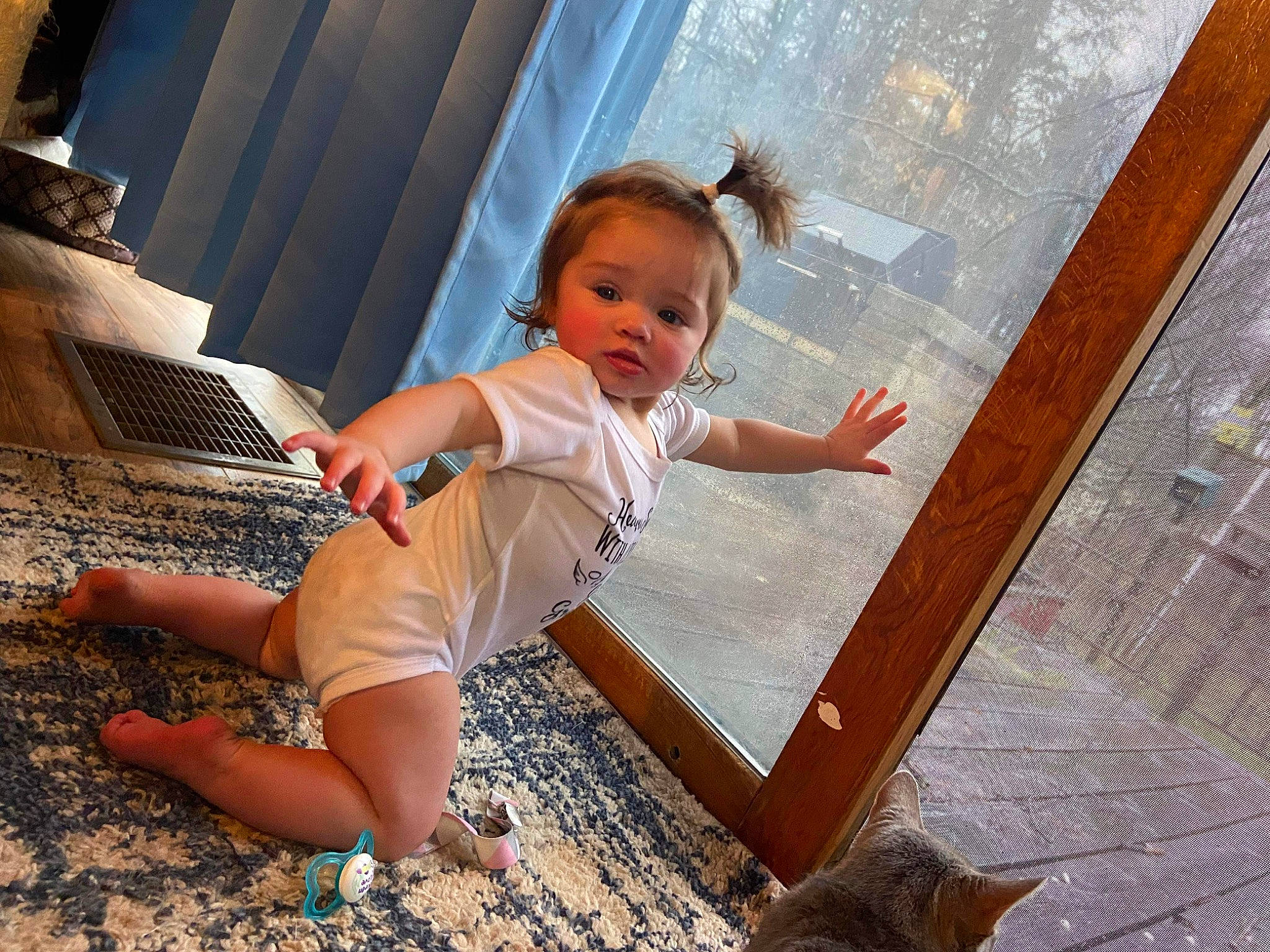 Lillian is registered to the contest to win money with this photo: baby, baby_toddler_clothing, barefoot, child, eye, flash_photography, floor, flooring, foot, fun, happy, hardwood, human_leg, leisure, person, sitting, t_shirt, thigh, toddler, waist