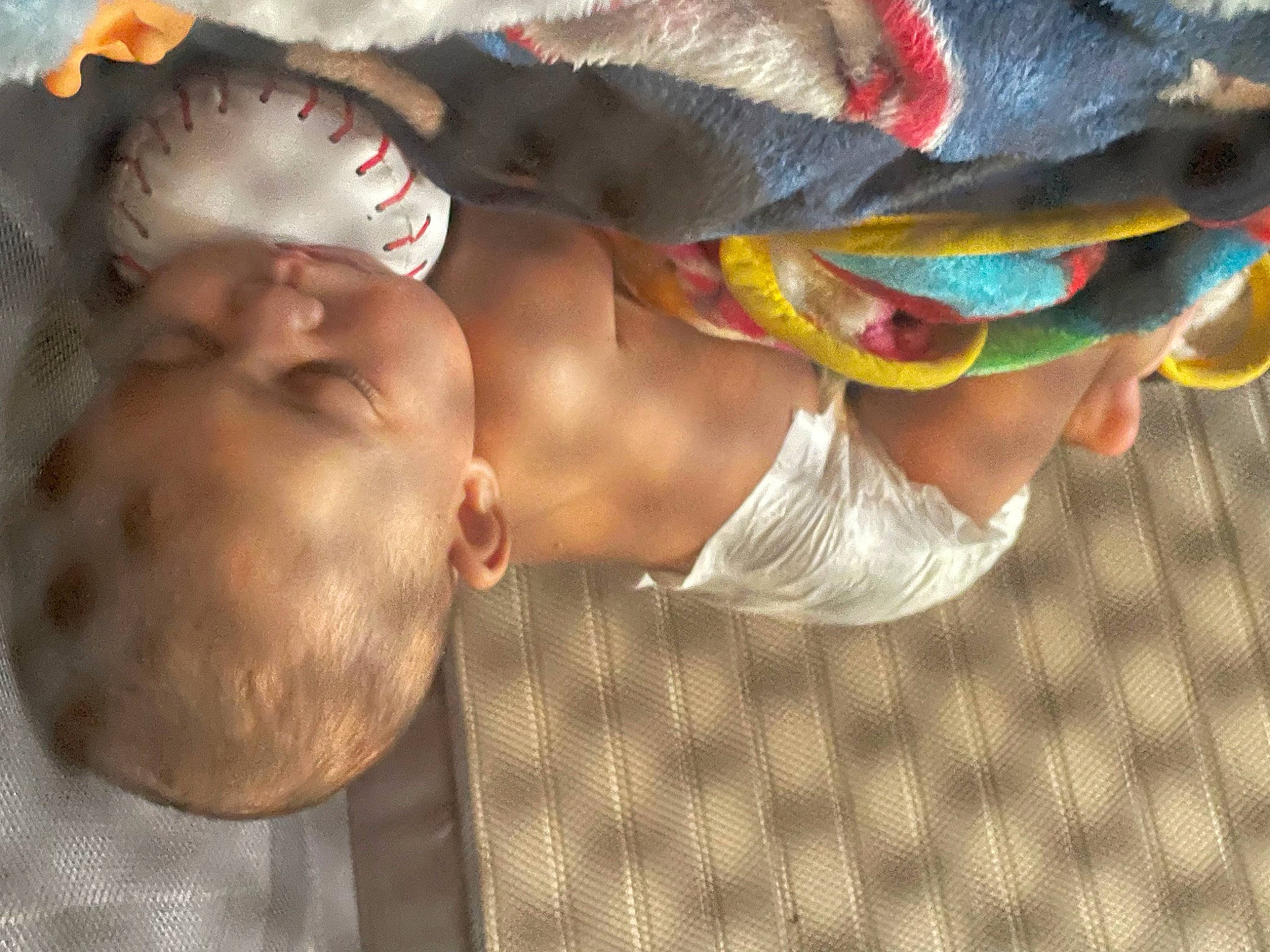 Novah is registered to the contest to win money with this photo: abdomen, baby, barechested, chest, child, elbow, event, flesh, fun, happy, hat, headgear, leisure, pattern, person, toddler, tree, trunk, vacation