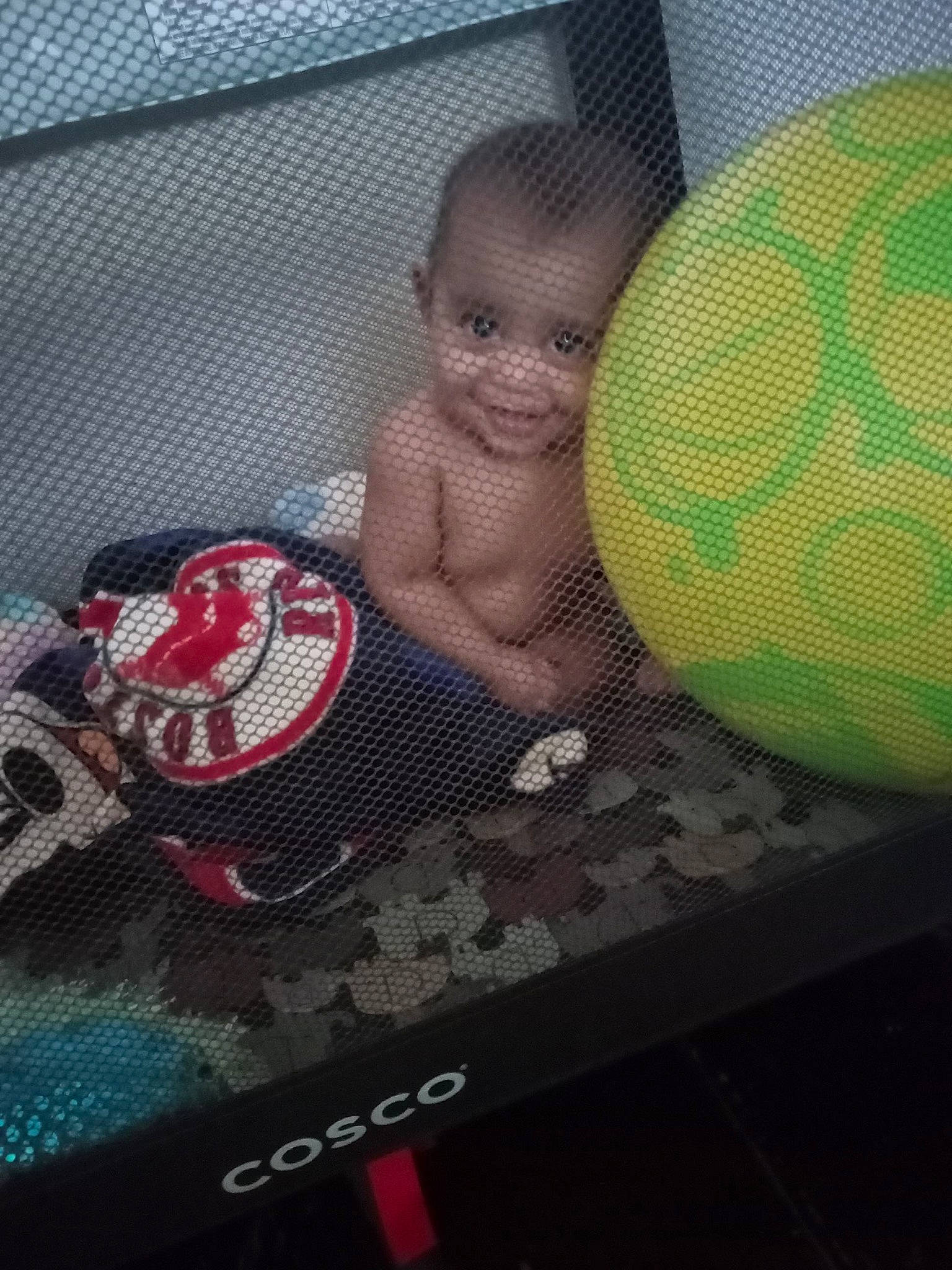 Novah is registered to the contest to win money with this photo: baby, barechested, barefoot, bedding, carmine, chest, child, comfort, electronic_device, flooring, foot, human_leg, joy, leisure, linens, pattern, person, room, sitting, textile