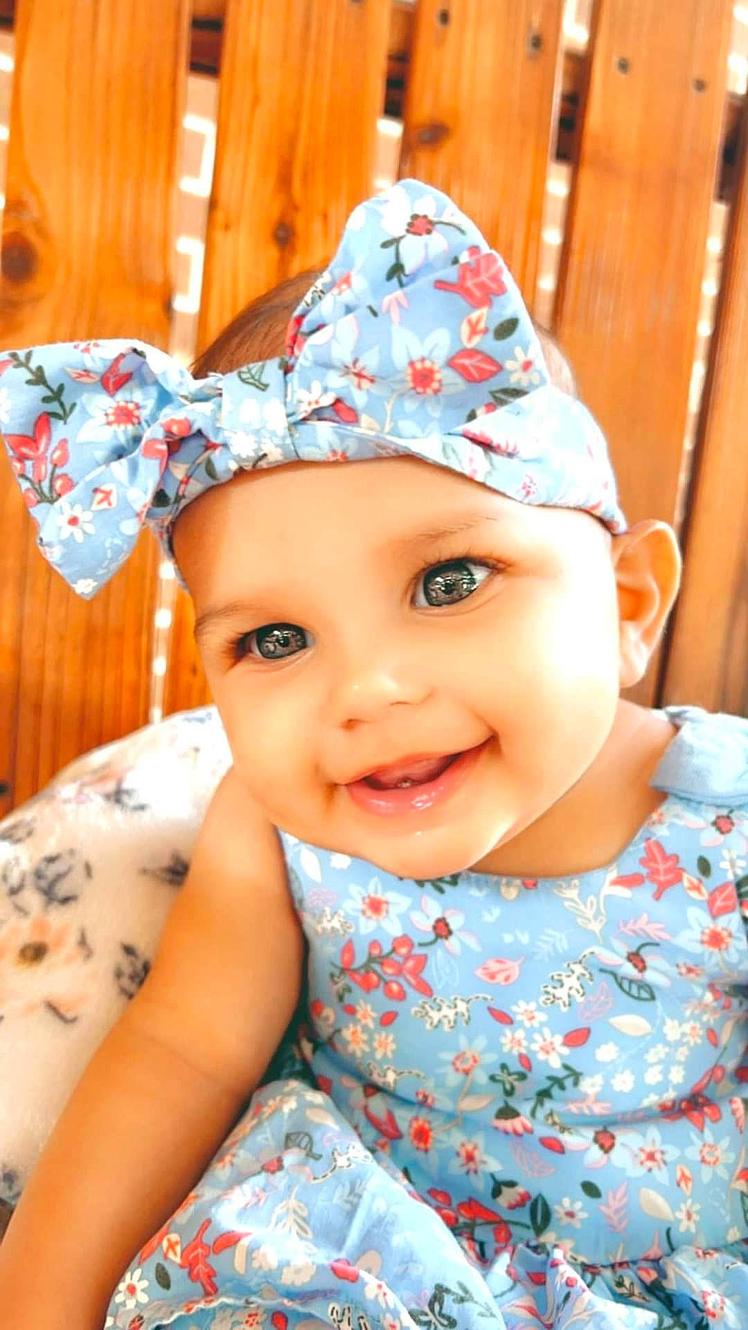 Gabriella joined the competition — help win amazing prizes! baby, baby_toddler_clothing, cap, child, costume_hat, face, facial_expression, fun, happy, hat, headgear, headwear, joy, leisure, party_hat, party_supply, pattern, person, pink, smile