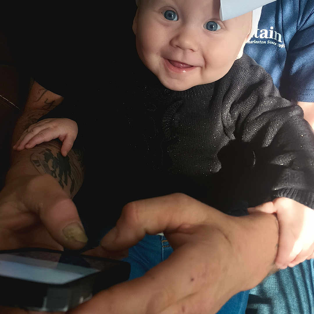 Presley Jo joined the competition — help win amazing prizes! accessories, baby, bodypart, clothing, electronics, face, finger, hand, happy, hat, head, mobilephone, person, phone, photography, portrait, skin, smile, tattoo, wrist